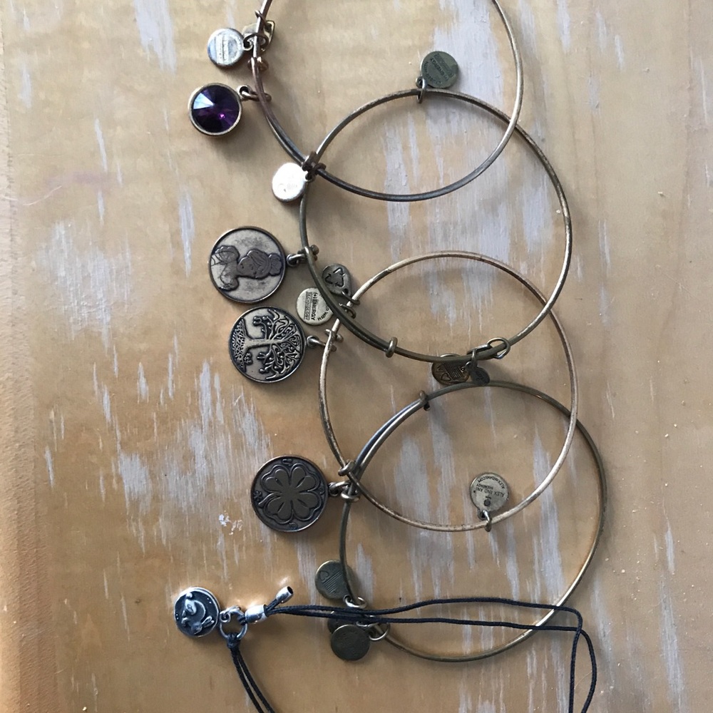 Five Alex and Ani bracelets